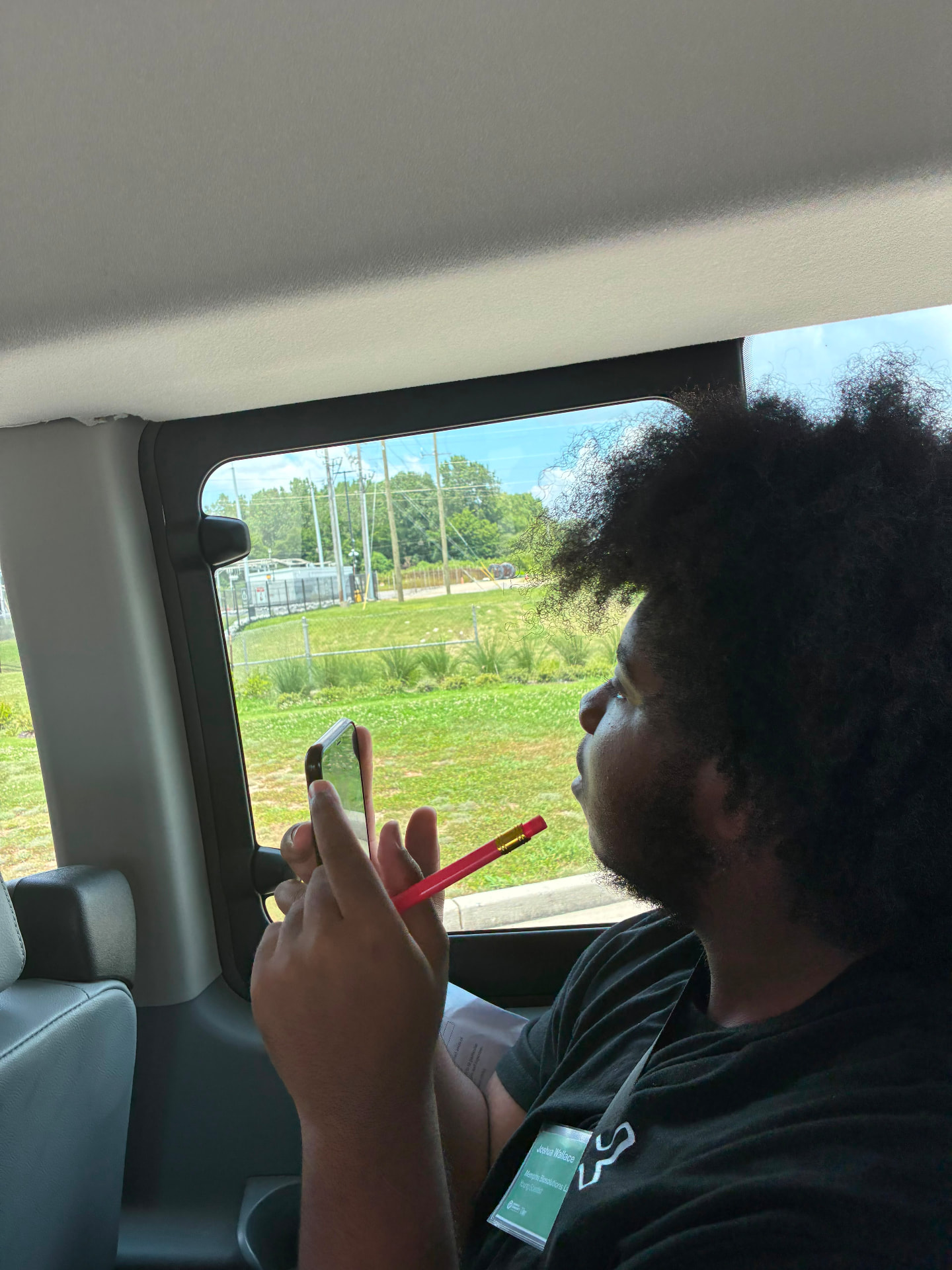 A young scientist documenting observations during a field trip